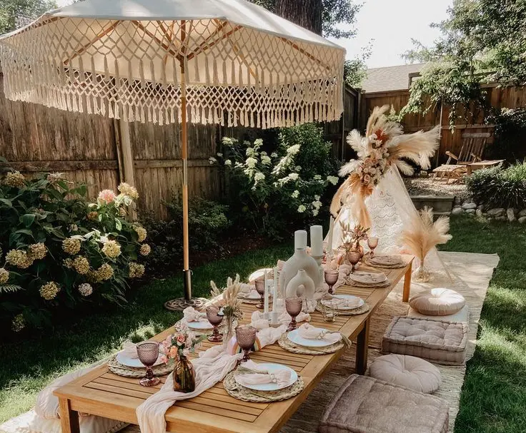 alt="Boho garden picnic setup by WawaWeEvents"