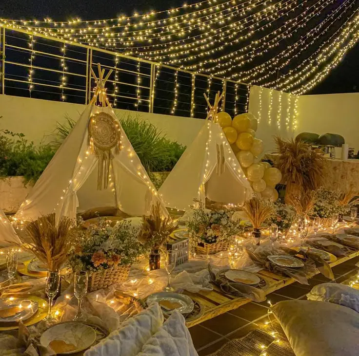 alt="Boho garden picnic setup by WawaWeEvents"