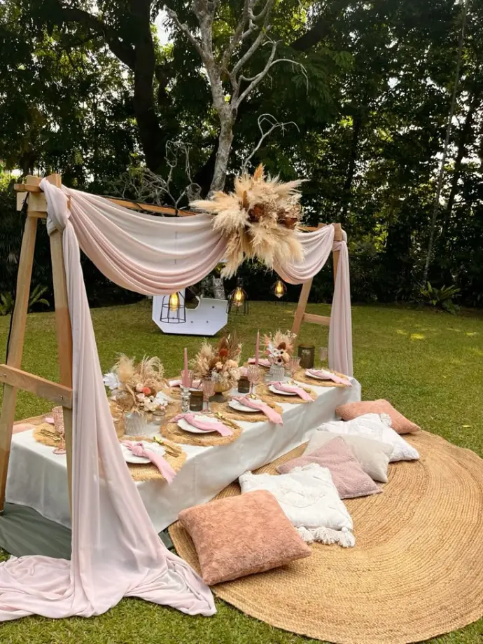 alt="Boho garden picnic setup by WawaWeEvents"